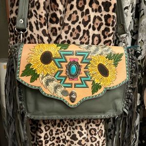 Hand made. One of a kind. Tooled leather. Paid over $400. Never used